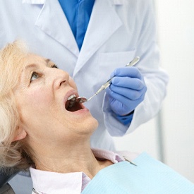 Dentist explaining the dental implant denture process