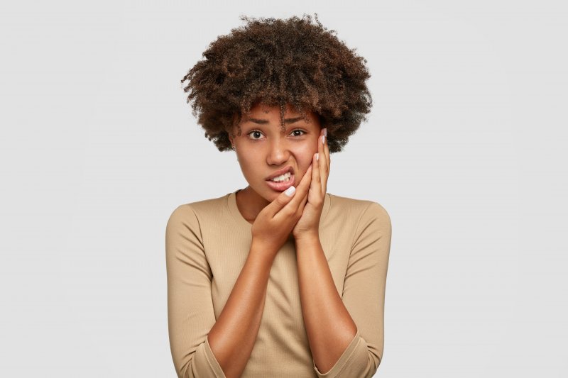 girl with toothache dental emergency